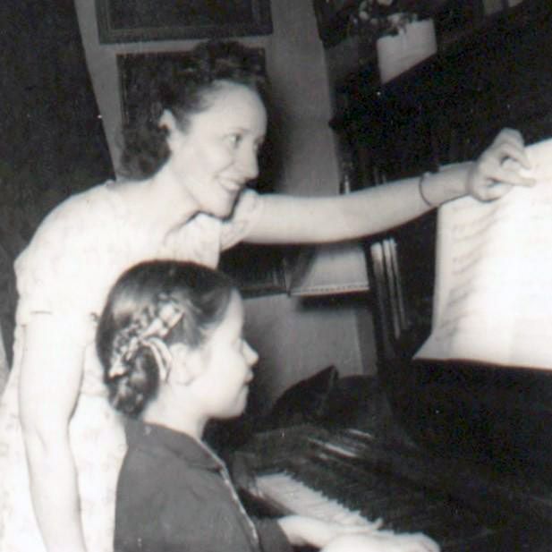Mimi at 17 at the piano with her niece, Michelle